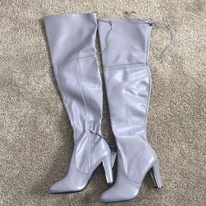 Thigh high leather heeled boots
